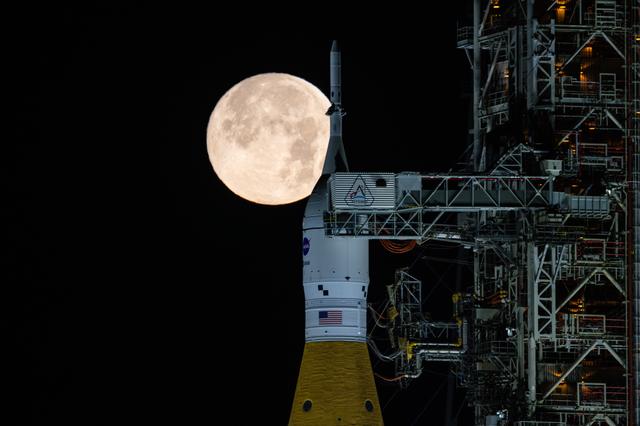 NASA image: Full Moon Rising Over Full Artemis II Stack at Launch Pad 39B